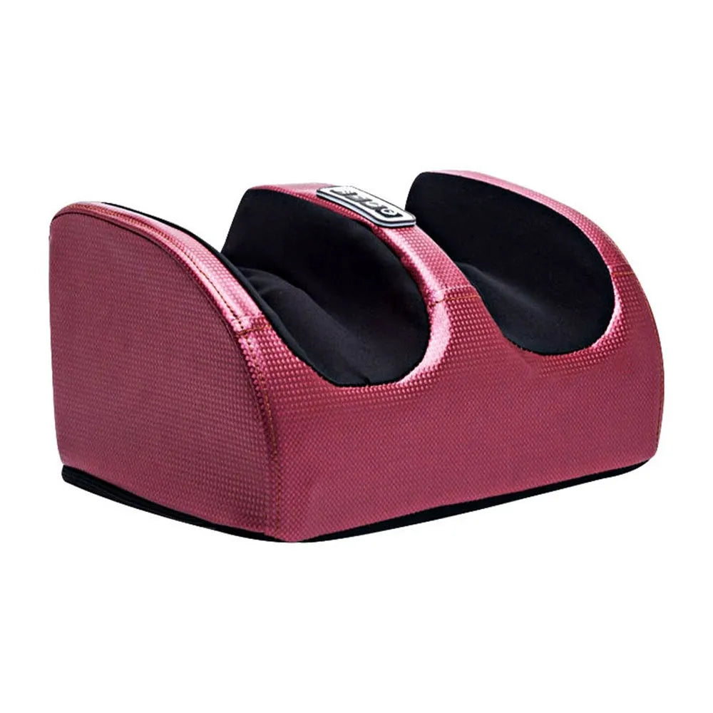 Automatic foot massage machine in gold colour with remote control on a wooden floor.