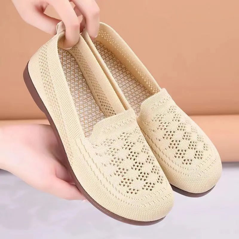Beige women's low-top mesh casual shoes with a round toe and lightweight PVC sole.