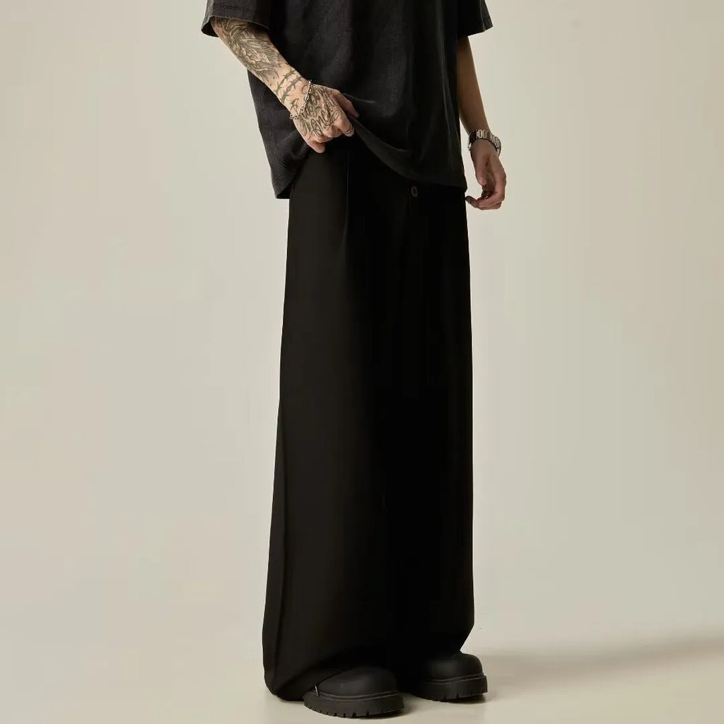Men's black wide-leg tube trousers with button fly and straight-leg design on hanger