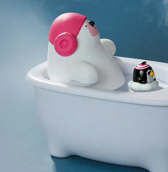 White polar bear-shaped USB air humidifier with water tank on a desk.