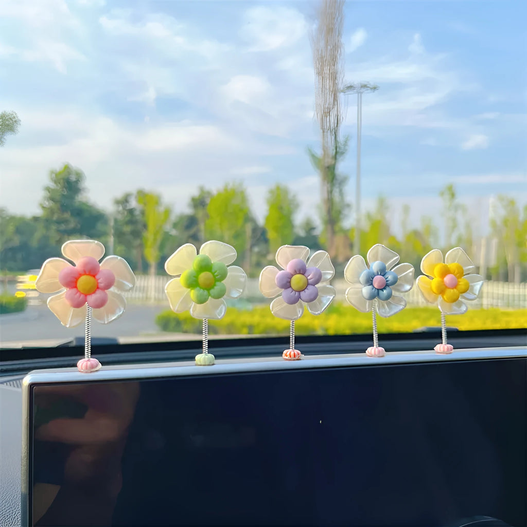 Small plastic swing decoration for car dashboard measuring 50mm by 35mm in multiple colours