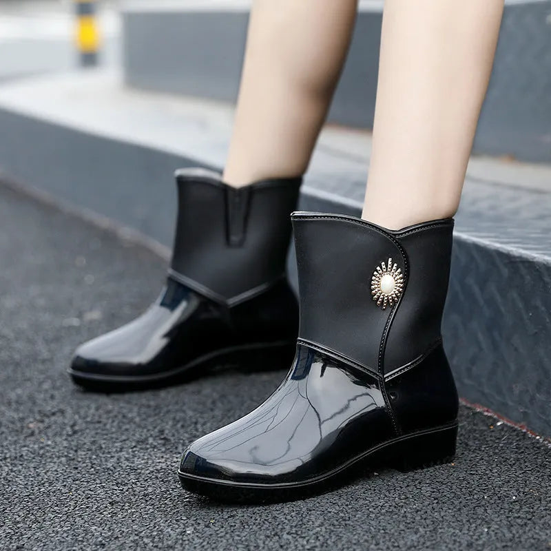 Women's middle tube rain boots in purple, black, and beige colours with non-slip soles