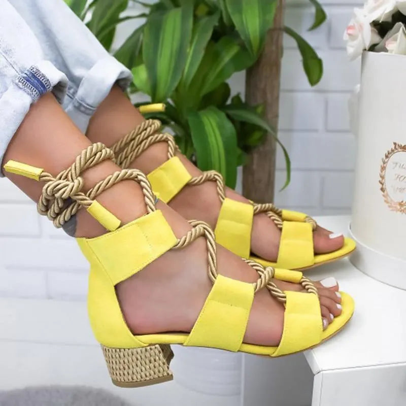 Women's beige suede sandals with front strap, fish mouth toe, and a colour-matching middle heel