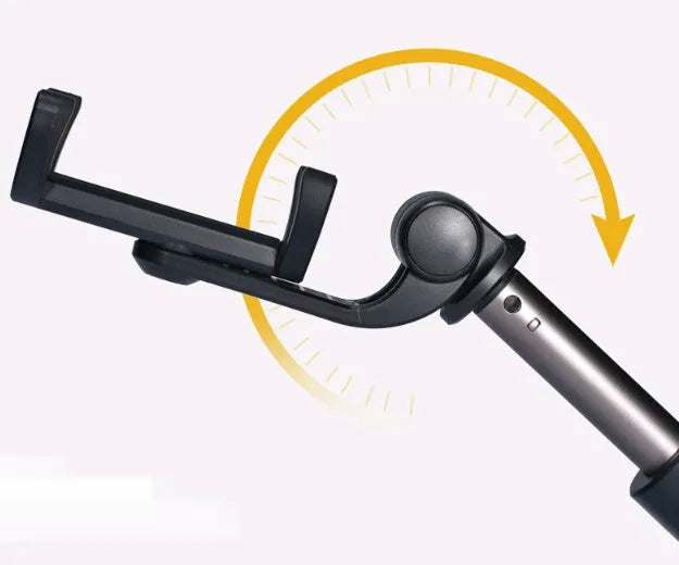 Aluminium alloy Bluetooth tripod selfie stick with remote control extended, holding a mobile phone.
