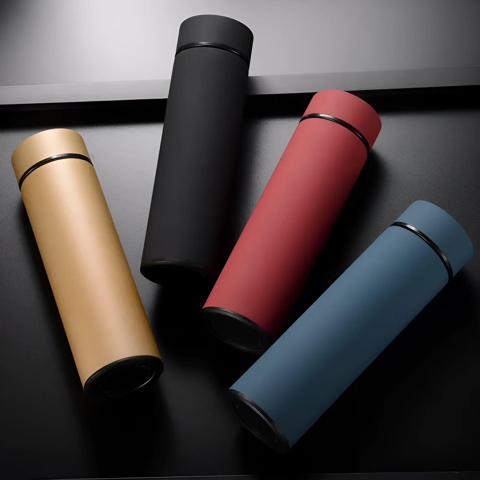 450ml stainless steel vacuum insulated water bottle with copper layer in black, red, gold, and blue colour options