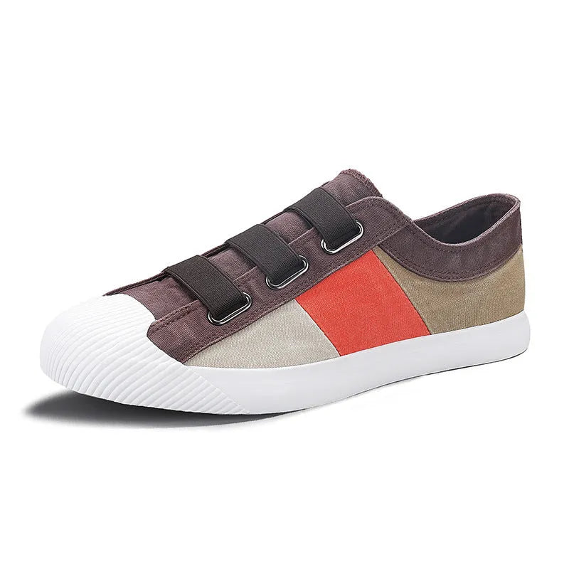 Men's beige canvas low-top sneakers with elastic band fastening and a vulcanised rubber sole.