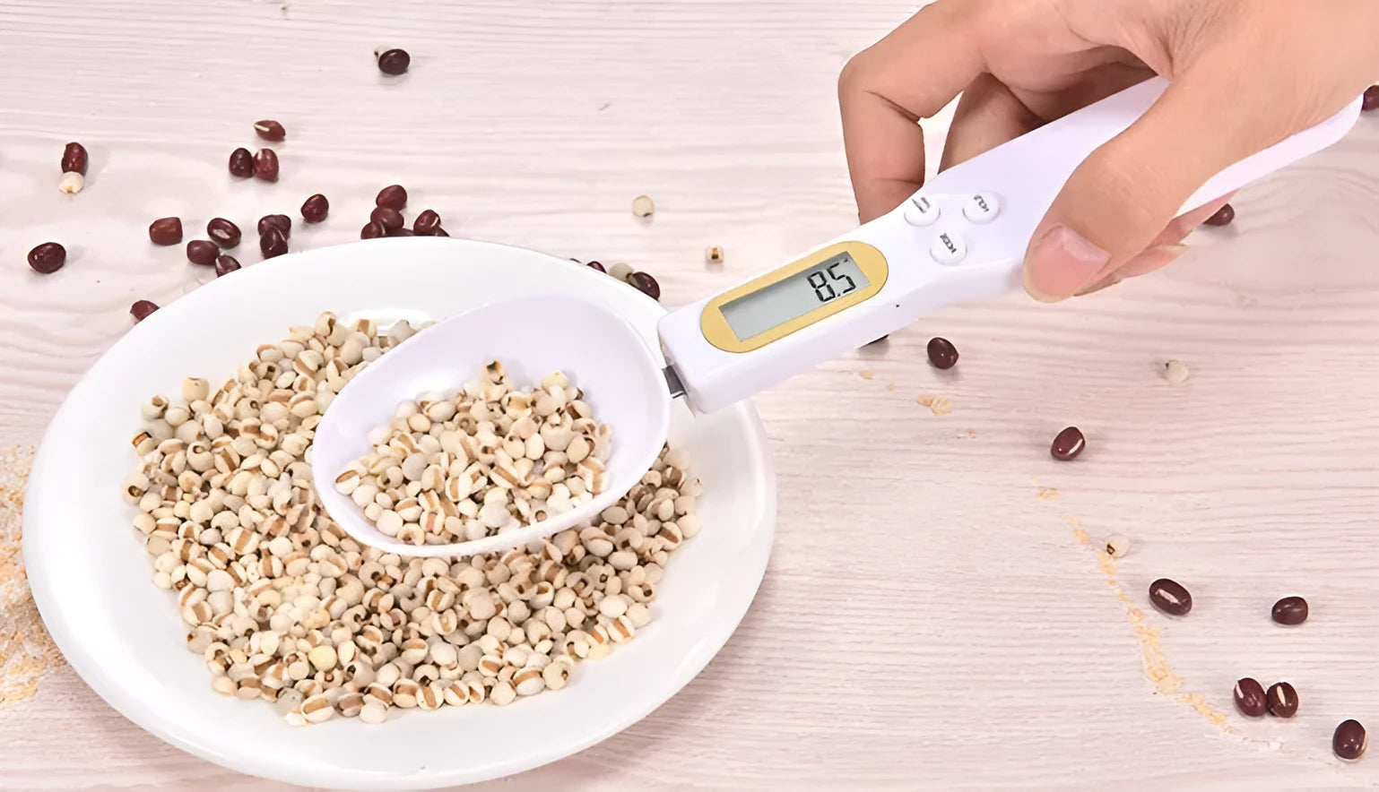 Black electronic measuring spoon scale showing digital display, 23.2cm long.