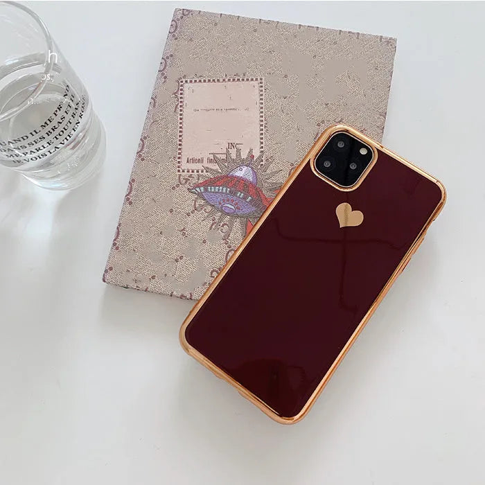Simple solid colour TPU back cover case for iPhone on a table, shown in blue.