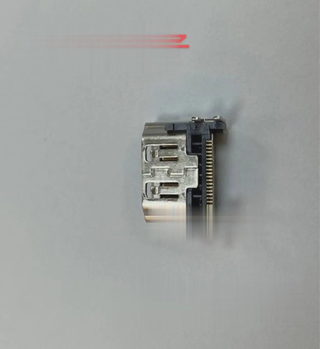 Silver-coloured HDMI host socket interface for game console repair.