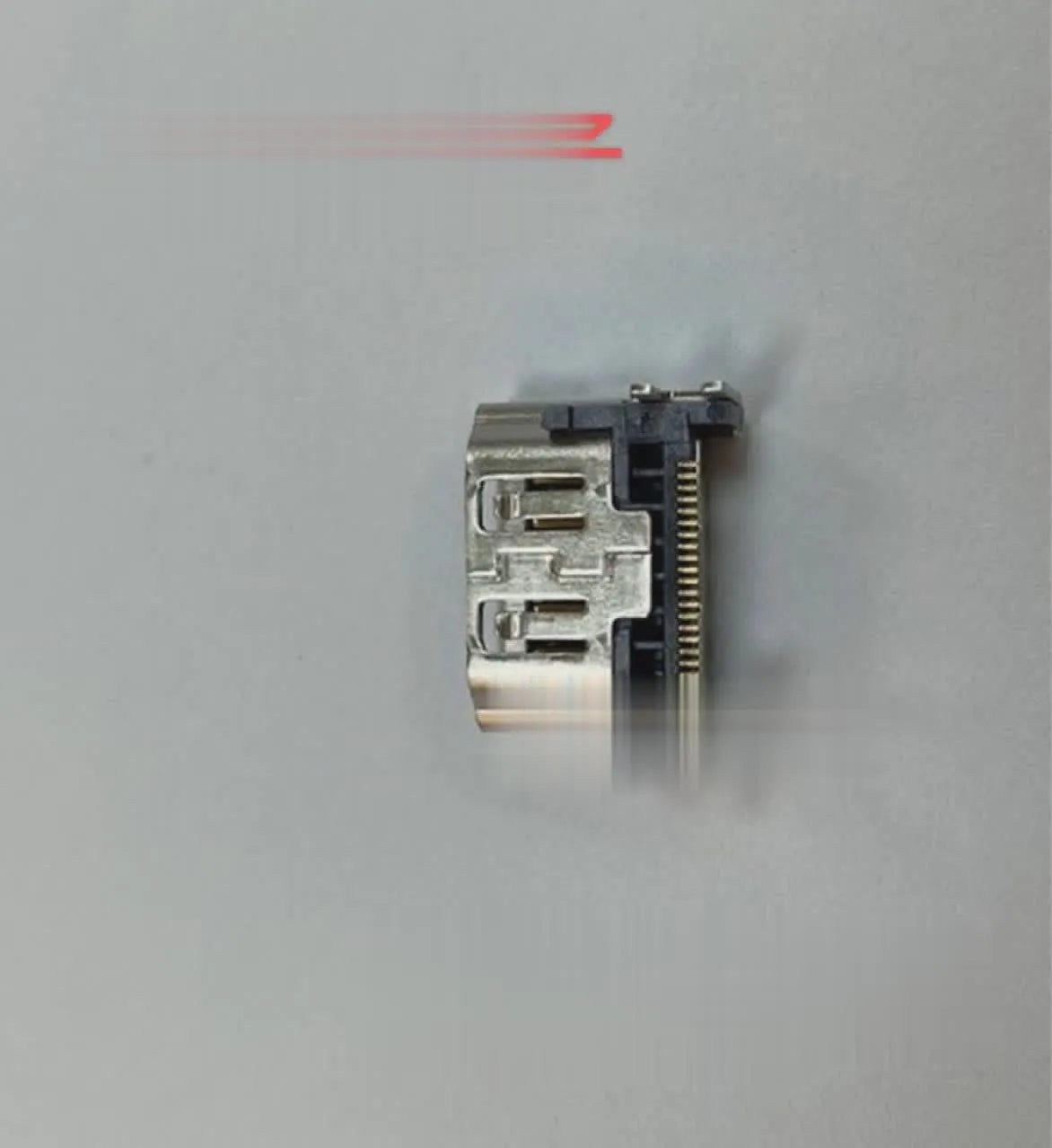 Silver-coloured HDMI host socket interface for game console repair.