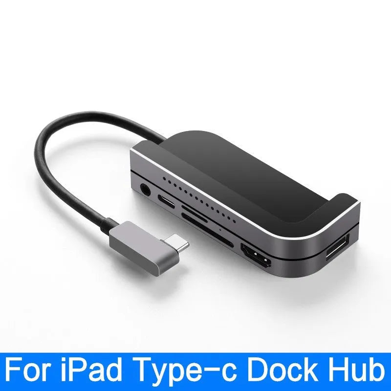 Silver aluminium grey 6-in-1 USB-C docking station for iPad Pro, shown next to a tablet.