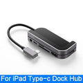 Silver aluminium grey 6-in-1 USB-C docking station for iPad Pro, shown next to a tablet.