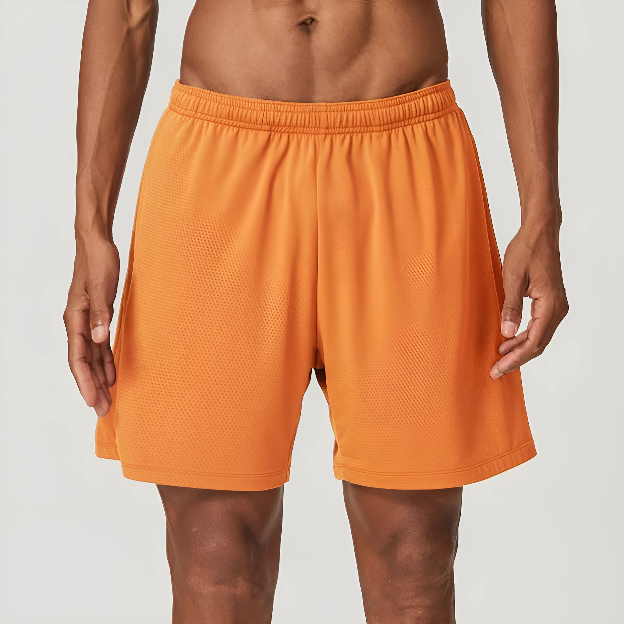Man's quick-drying athletic shorts in khaki colour, showing double-layer construction and mid-waist fit.