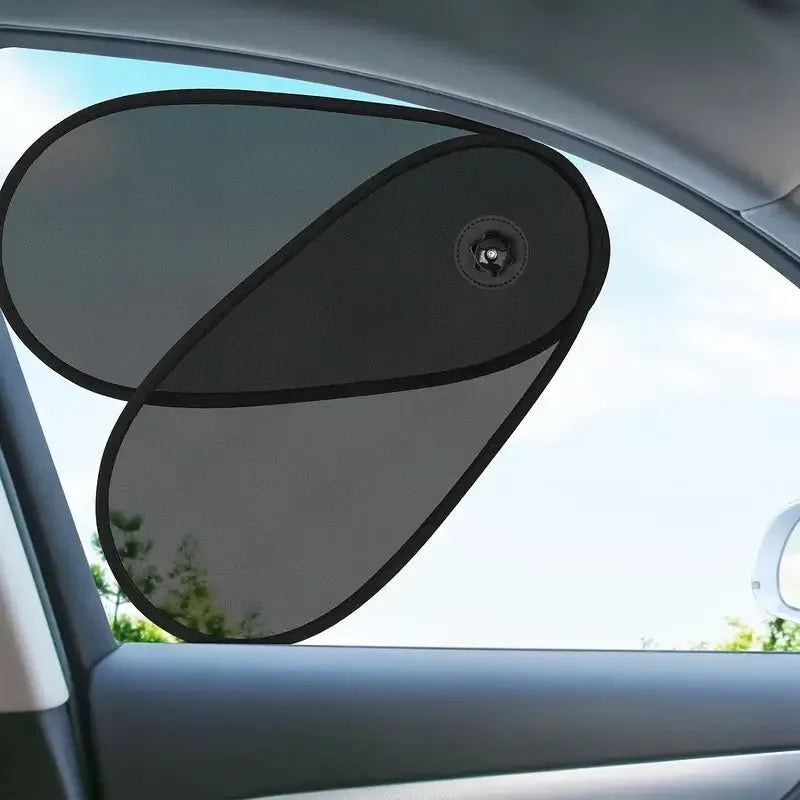 Black stretchy car side window shade installed with suction cups to protect baby from sun.