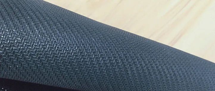 Large printed desk mat with natural rubber non-slip base on a wooden desk with keyboard and mouse.