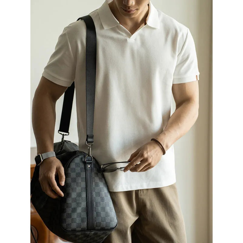 Man's blue American-style short-sleeved cotton blend polo shirt on a hanger.