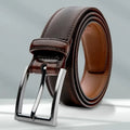 Men's brown genuine leather casual belt with an alloy buckle on a plain background.