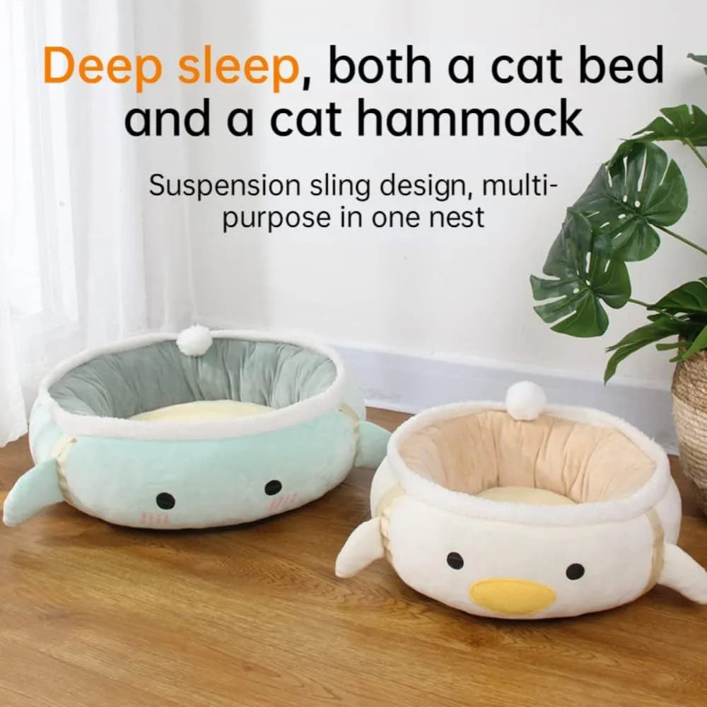 Green dinosaur and chick shaped cat bed shown both flat as a sofa and hanging as a hammock for small pets.