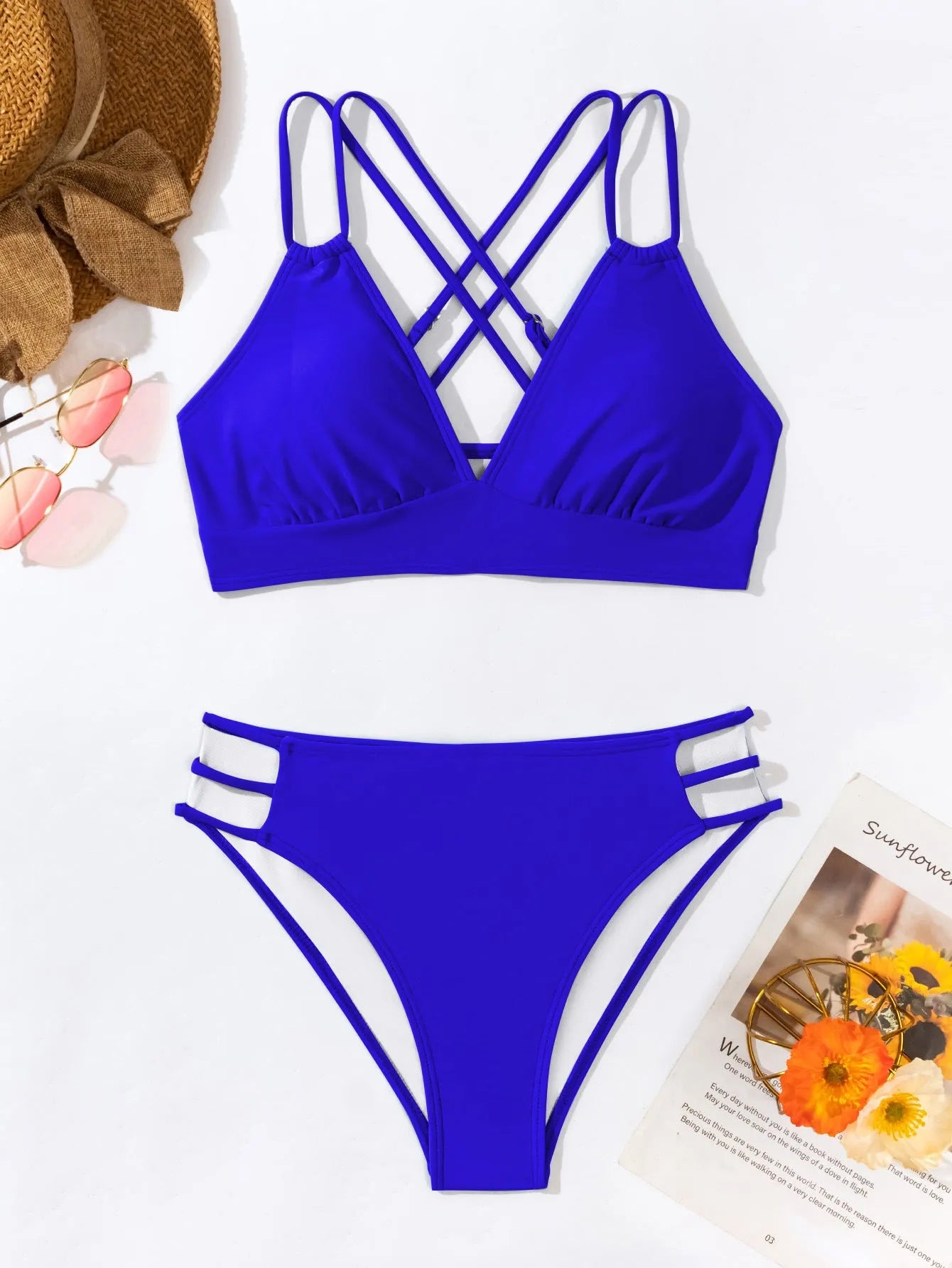 Women's black V-neck halter bikini with split leg shorts on a mannequin.