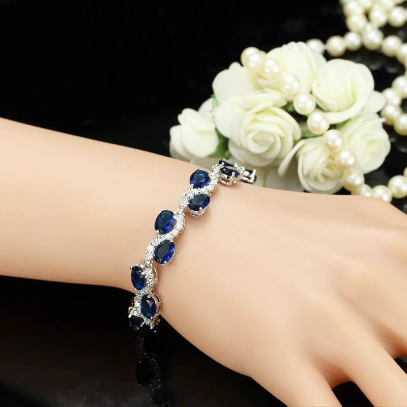 Copper gold plated bracelet with AAA+ zircon stones showing geometric design and 18.4 cm length