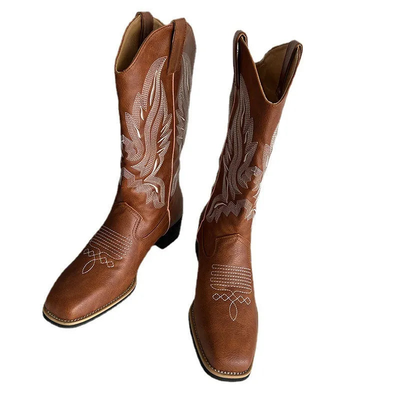 Brown women's embroidered mid-calf martin boots with leather lining and a square heel.