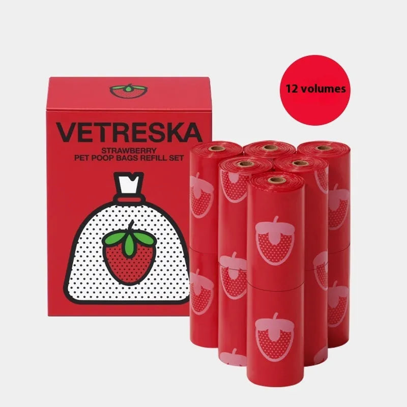 Portable dog poop bag dispenser capsule in strawberry, orange, and cherry blossom patterns with a roll of scented bags.