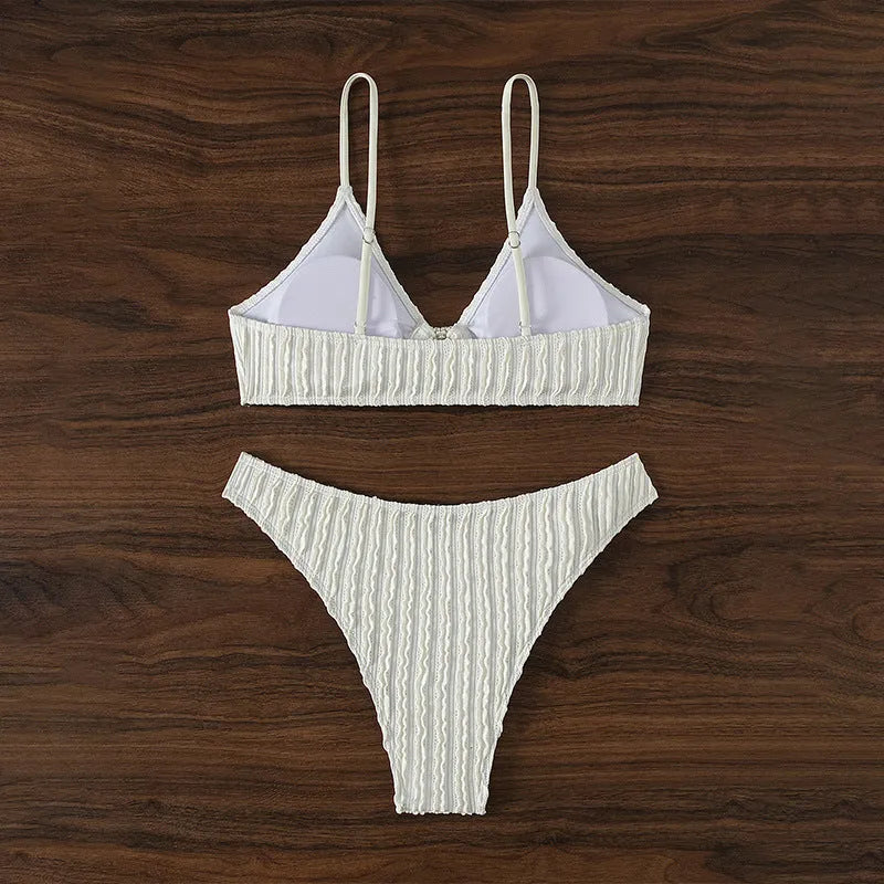 White women's V-neck swimsuit with split design and matching shorts