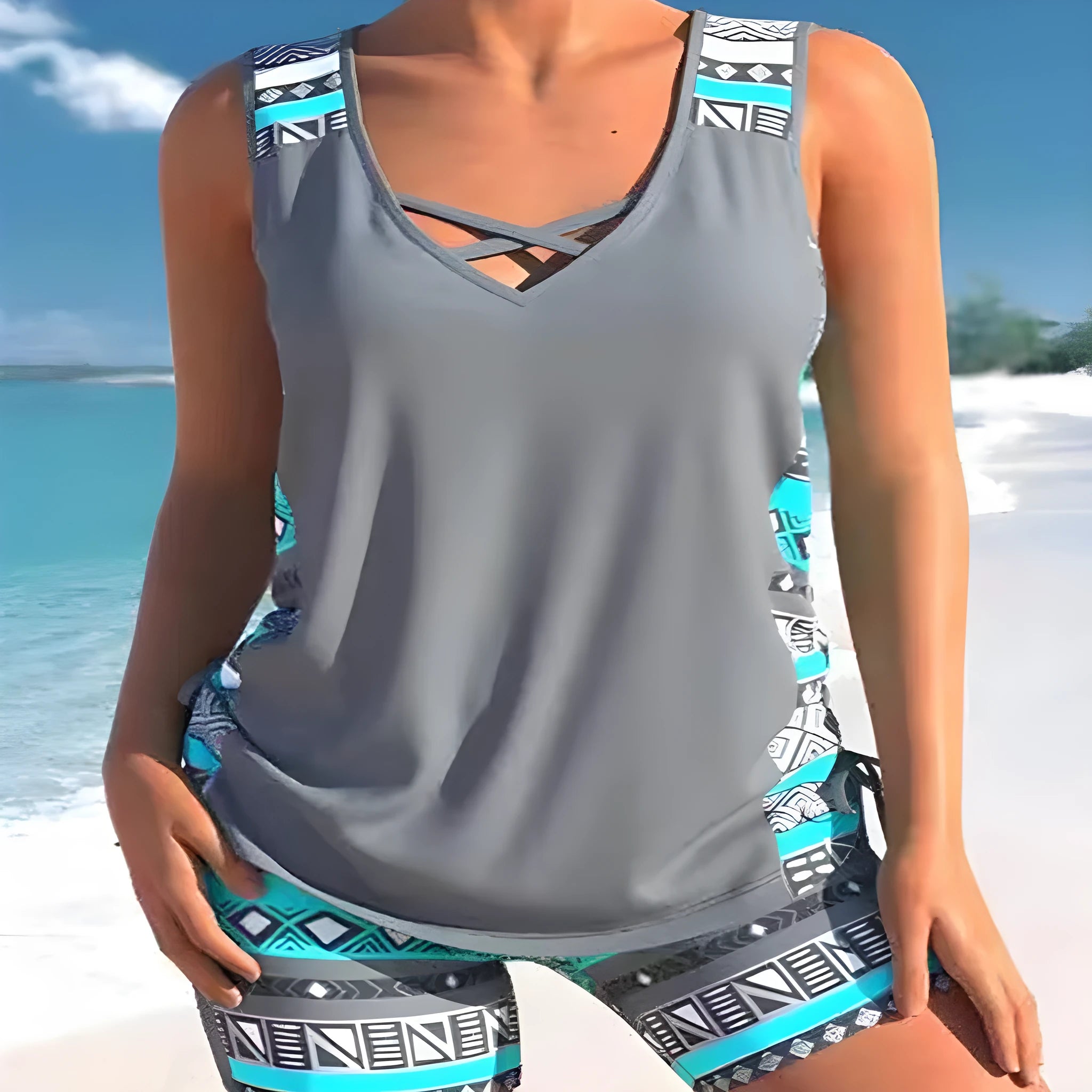 Women's floral printed two-piece swimsuit with sleeveless top and matching shorts in blue or green