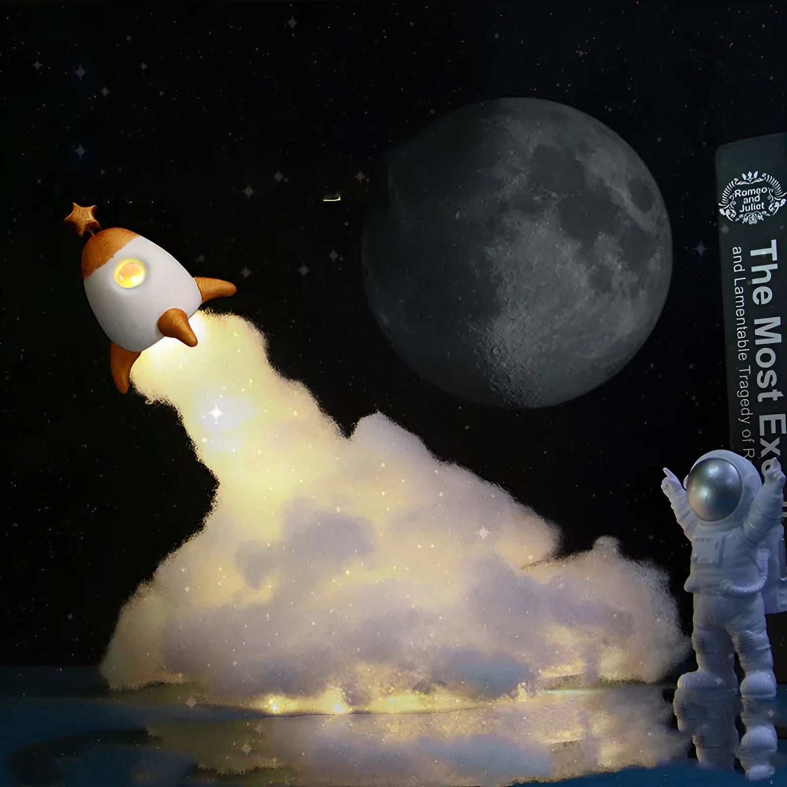 DIY astronaut rocket night light kit with LED string lights, small model, and straws for assembly on a desk.