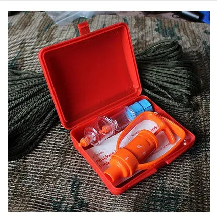 Orange portable venom extractor suction device first aid kit open to show pump, two suction cups, and accessories.