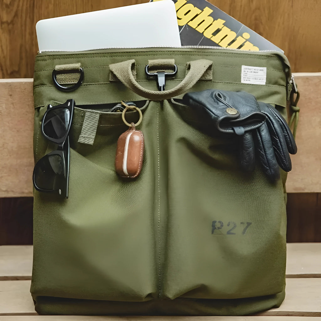 Canvas crossbody messenger bag in military green with shoulder strap showing vertical square shape and zipper closure