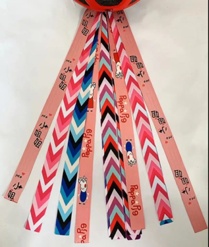 Children's decorative helmet streamer ribbon in multiple colours for roller skating and skiing safety gear.