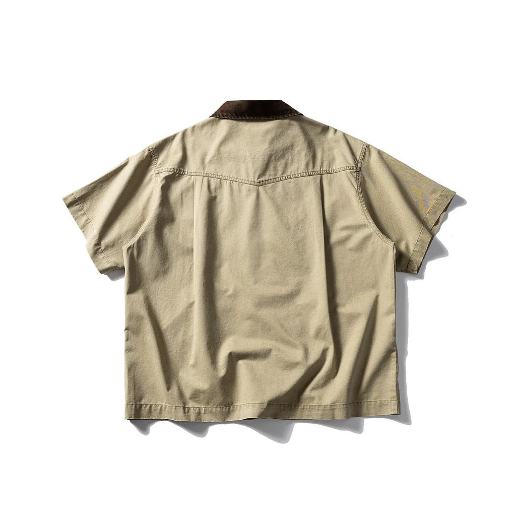 Short sleeve washed overalls shirt in a loose cardigan style, shown in khaki colour.