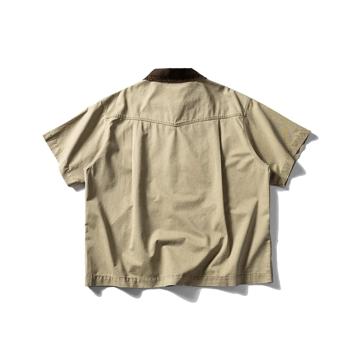 Short sleeve washed overalls shirt in a loose cardigan style, shown in khaki colour.