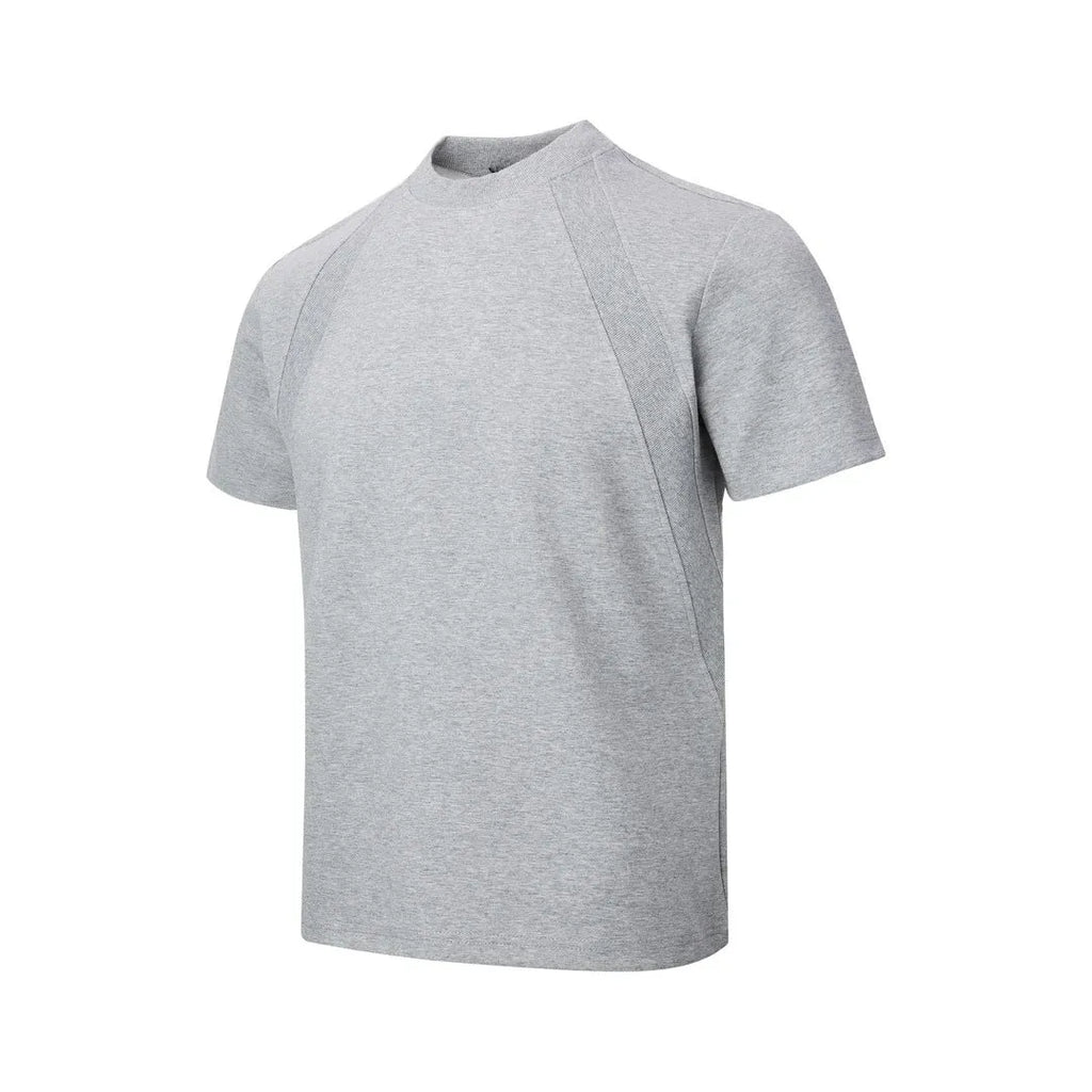 Man wearing a black loose-fit short sleeve top with visible air layer stitching texture.