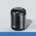 Compact black portable Bluetooth speaker showing front speaker grille and control buttons