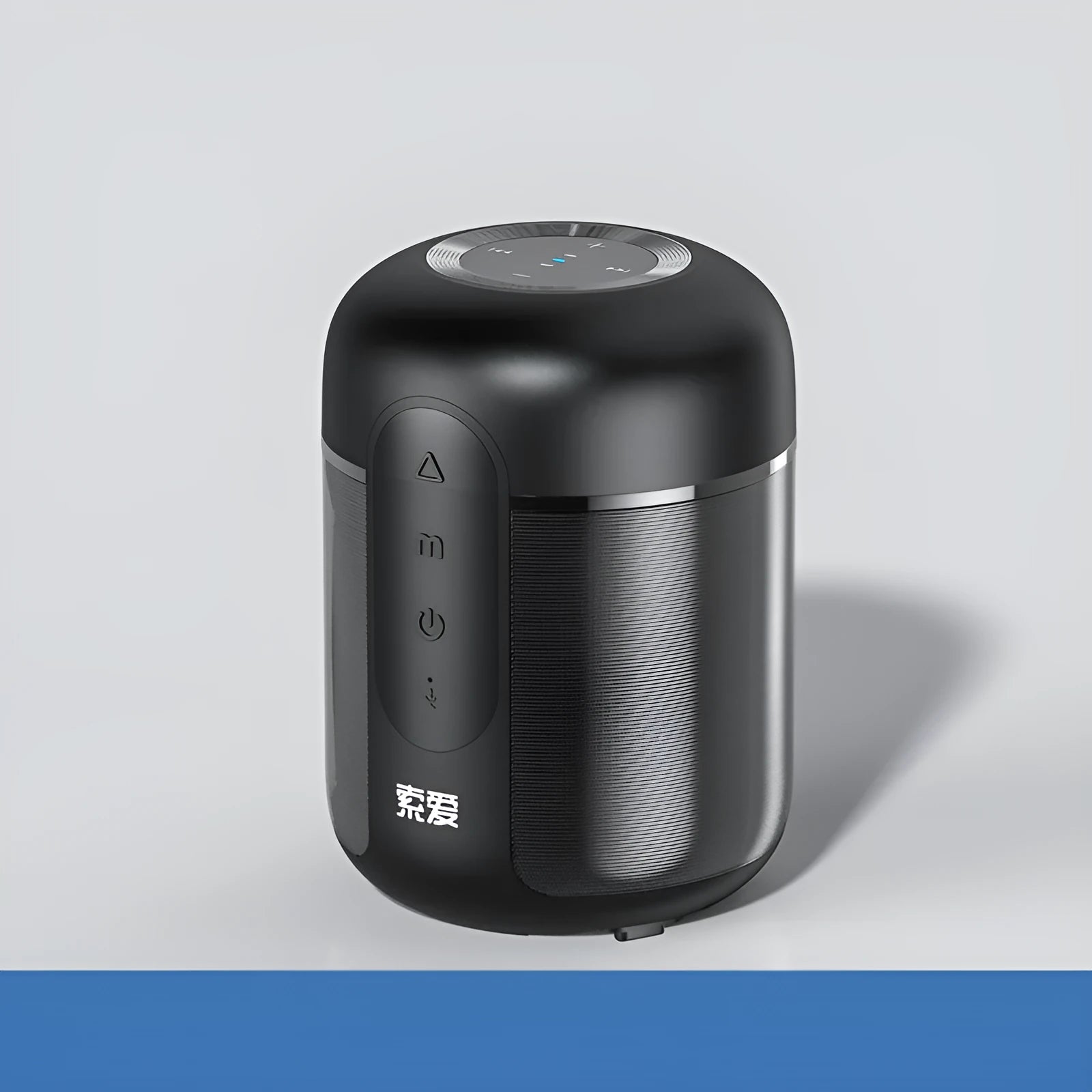 Compact black portable Bluetooth speaker showing front speaker grille and control buttons