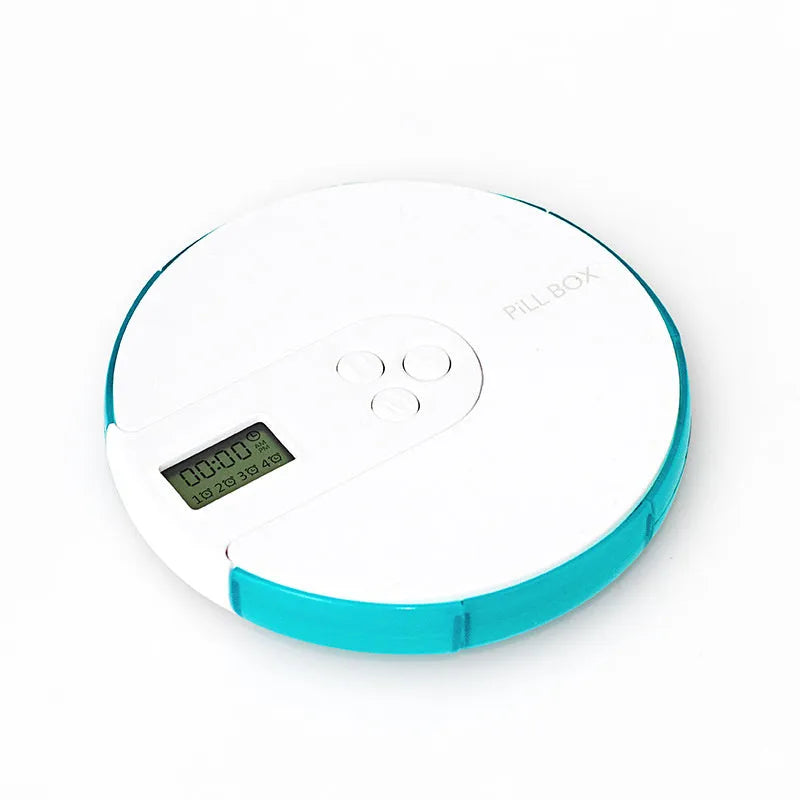Blue 7-compartment alarm clock pill dispenser showing digital display and pill slots.