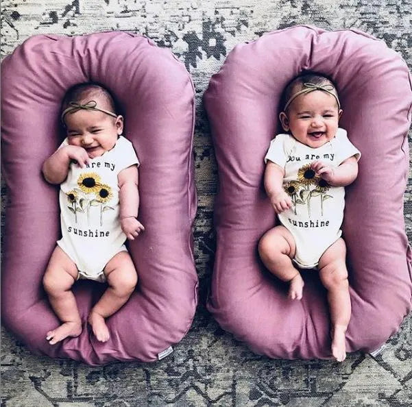 Beige portable cotton baby nest crib for newborn, measuring 75cm by 45cm.