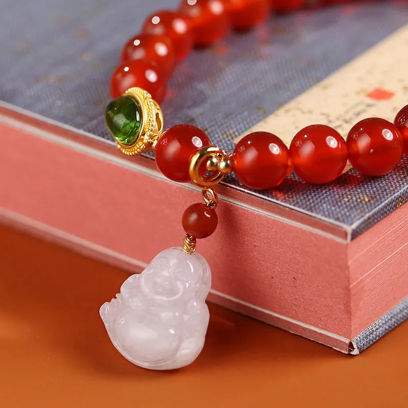 Handmade women's bracelet with red agate and amber Maitreya Buddha pendant.