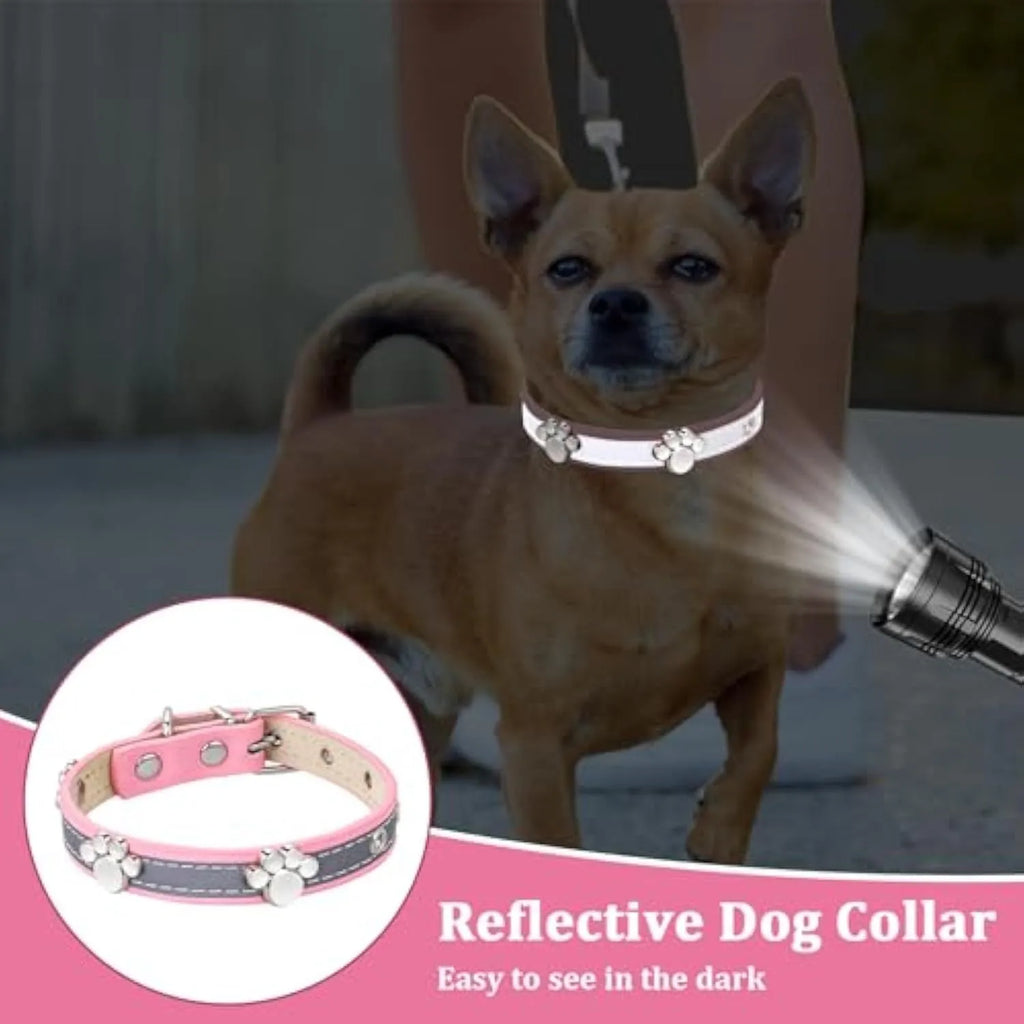 Reflective PU leather dog collar with metal paw rivets and an adjustable buckle on a grey background.