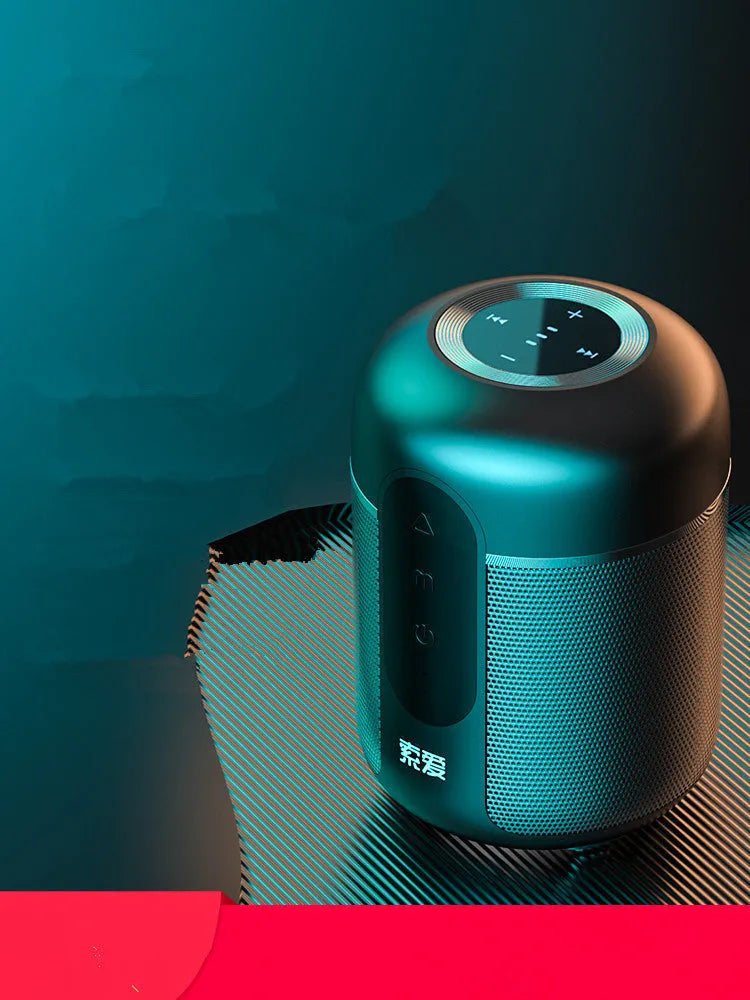 Compact black portable Bluetooth speaker showing front speaker grille and control buttons