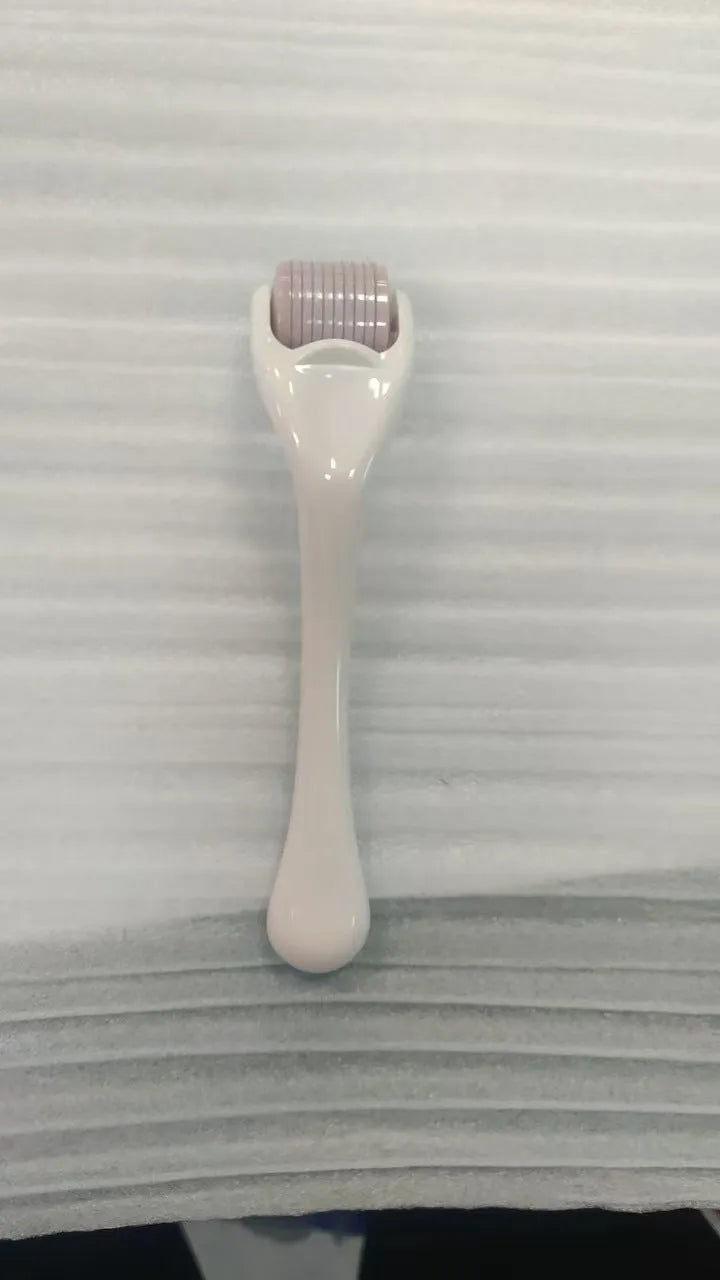 540 micro needle derma roller showing handle and needle wheel in a selected colour