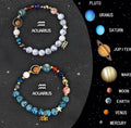 Set of twelve natural stone bead bracelets laid out, each representing a different zodiac sign.