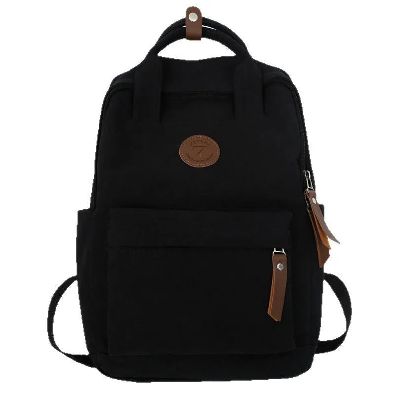 Black Oxford cloth backpack with curved shoulder straps for school and travel use