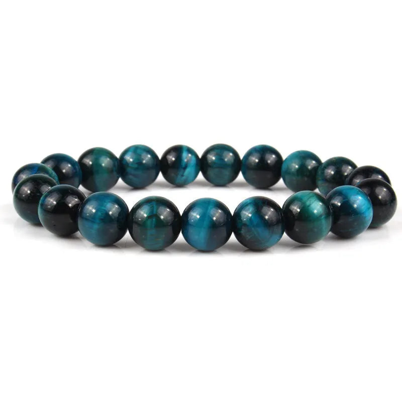 Natural tiger eye crystal beaded bracelet for men and women on a white background.