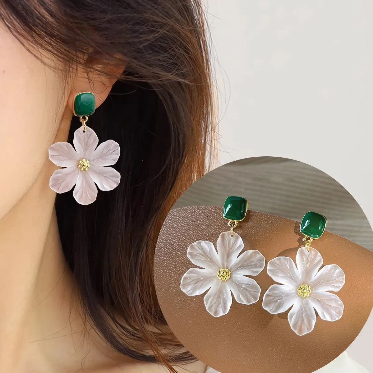 A pair of dark green alloy earrings with a detailed needle flowers sweet floral design.