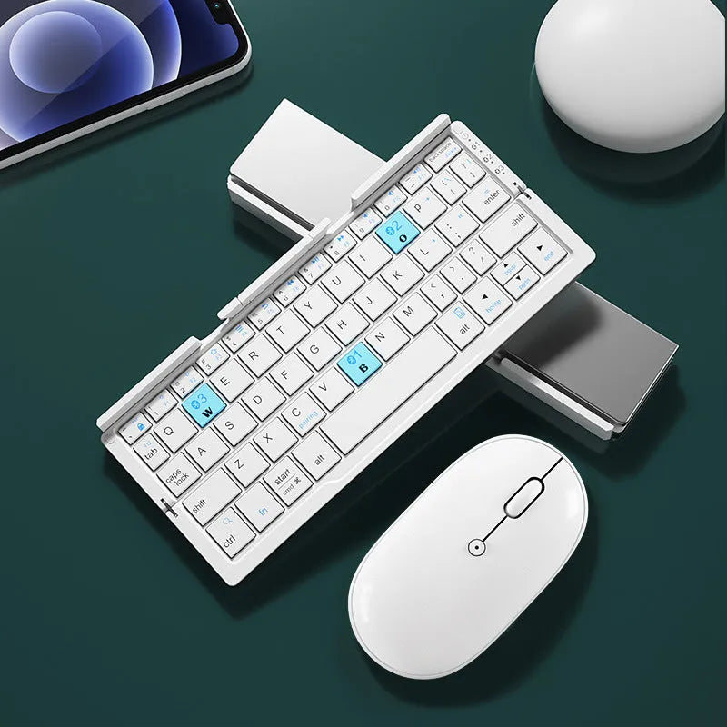 Aluminium folding Bluetooth keyboard open with smartphone on stand showing silver white finish