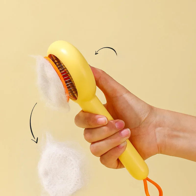 Small yellow duck-shaped pet grooming comb with open section and needle teeth