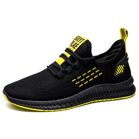 Men's low-top casual sports shoes with Flying Weave upper, cross straps on striped pattern, and flat sole.
